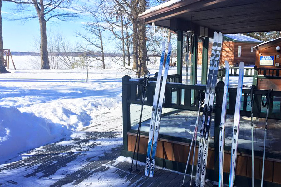 Cross Country Skis leaning against a cabin rental.
